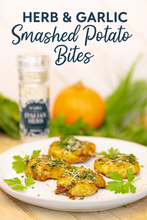 Load image into Gallery viewer, Crispy smashed potatoes seasoned with Summa Salts Italian Herb Salt, served with fresh herbs and Parmesan