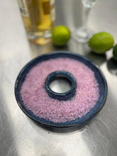 Load image into Gallery viewer, Close-up of a hand-thrown ceramic salt rimmer dish filled with pink salt, with fresh limes and a margarita glass in the background