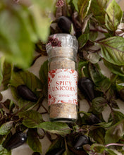 Load image into Gallery viewer, Spicy Italian Salt being sprinkled over roasted vegetables from a glass grinder